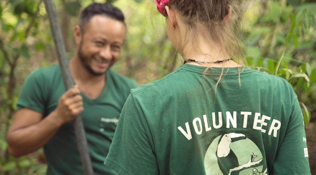 A teenager and a Projects Abroad staff member working on a reforestation initiative during Conservation volunteering in Costa Rica. A staff member and a volunteer plant seedlings on a Conservation placement in Costa Rica for teenagers.